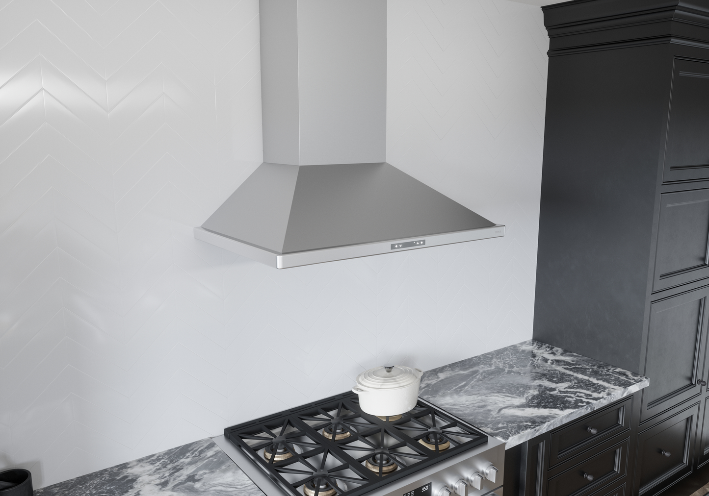 Stainless steel wall mounted chimney hood above gas cooktop in modern kitchen setting with dark cabinetry and marble countertop