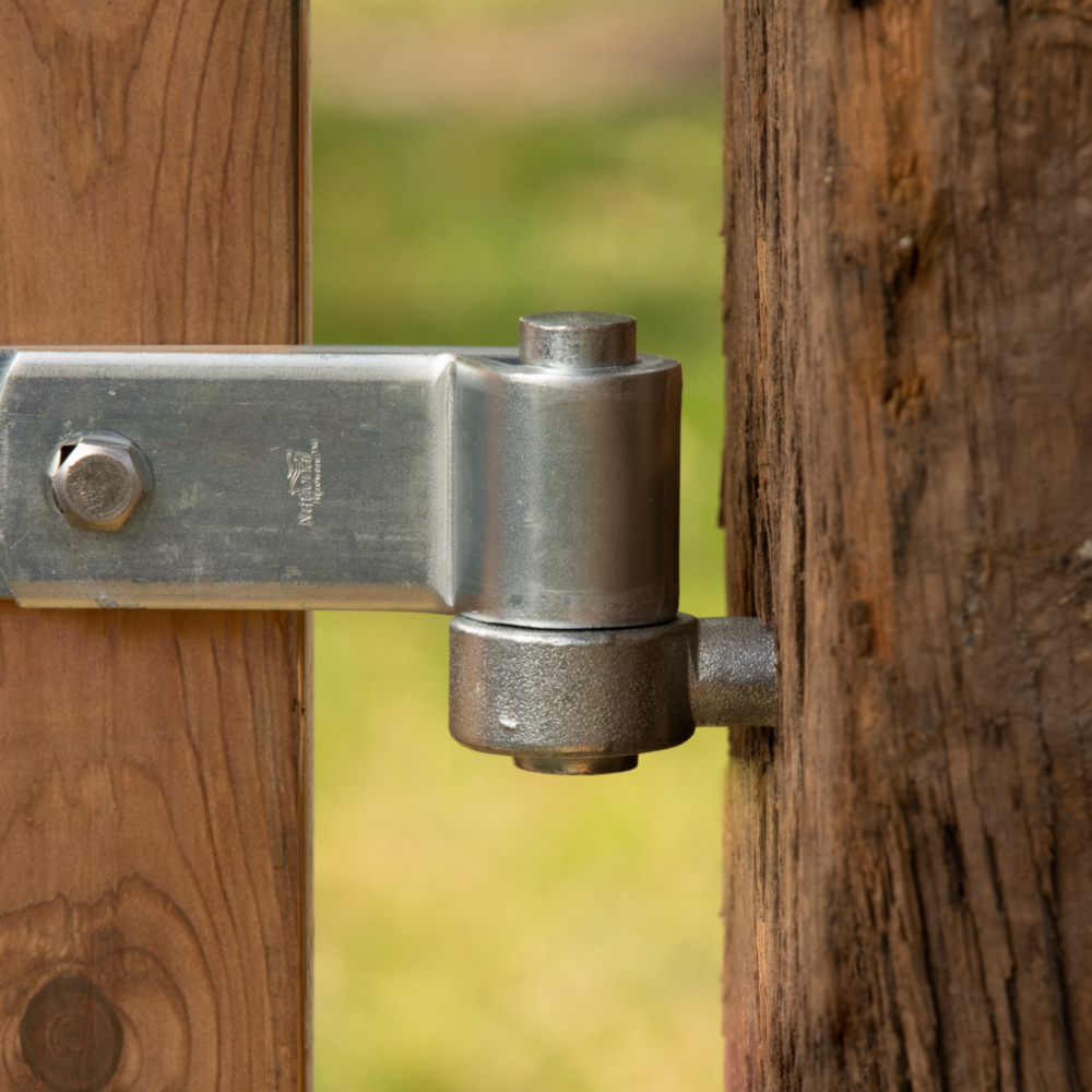 Metal gate hinge mounted on wooden frame for door and gate accessories in home improvement hardware collection under $50