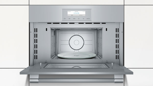 Silver combination wall oven with digital display, convection fan, and open door in modern kitchen setting