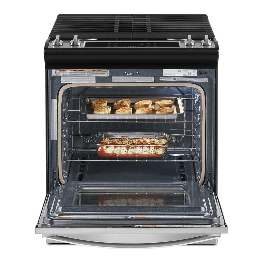 Gas slide-in range with open oven door showing baked casseroles on two racks in Ranges & Cooktops at Hartville Hardware