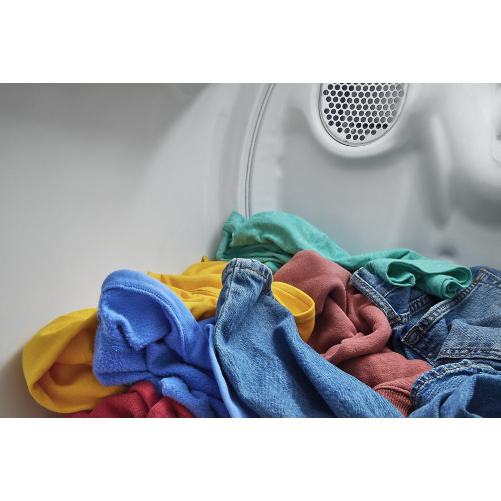 Colorful clothes inside the drum of a vented top load gas dryer from the Dryers and Appliances collection