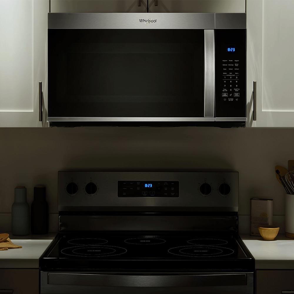 Stainless steel 30-inch wide over-the-range microwave with digital display and sensor cooking in kitchen appliances collection