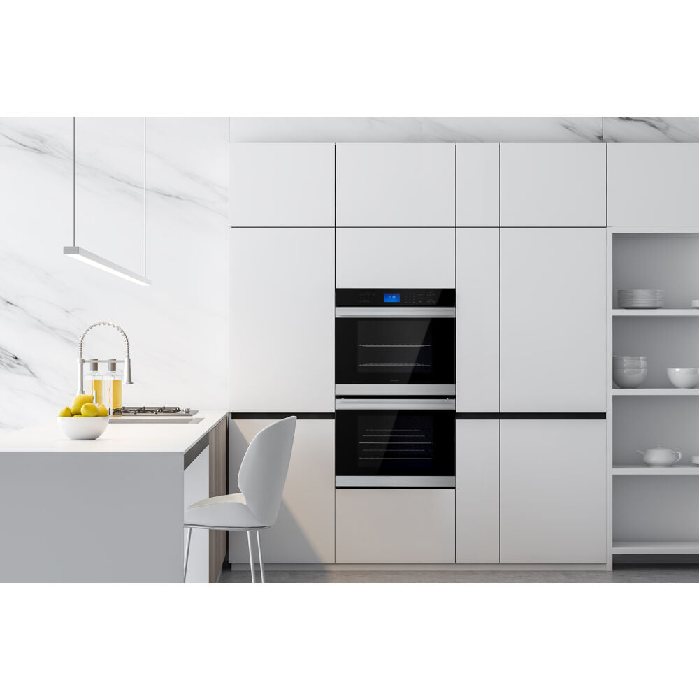 Built-in modern white kitchen cabinetry with sleek black glass double wall oven and minimalist island seating area