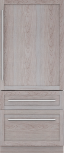 Built-in bottom freezer refrigerator with panel-ready wood finish and stainless steel handles in kitchen appliances collection