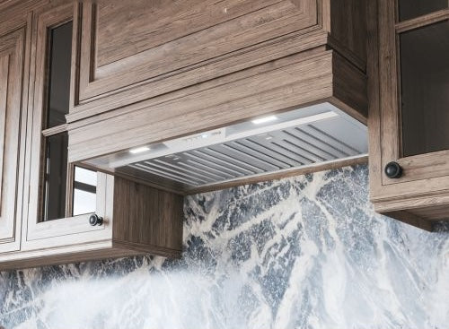 36-inch stainless steel insert range hood with LED lighting and Airflow Control Technology in kitchen setting