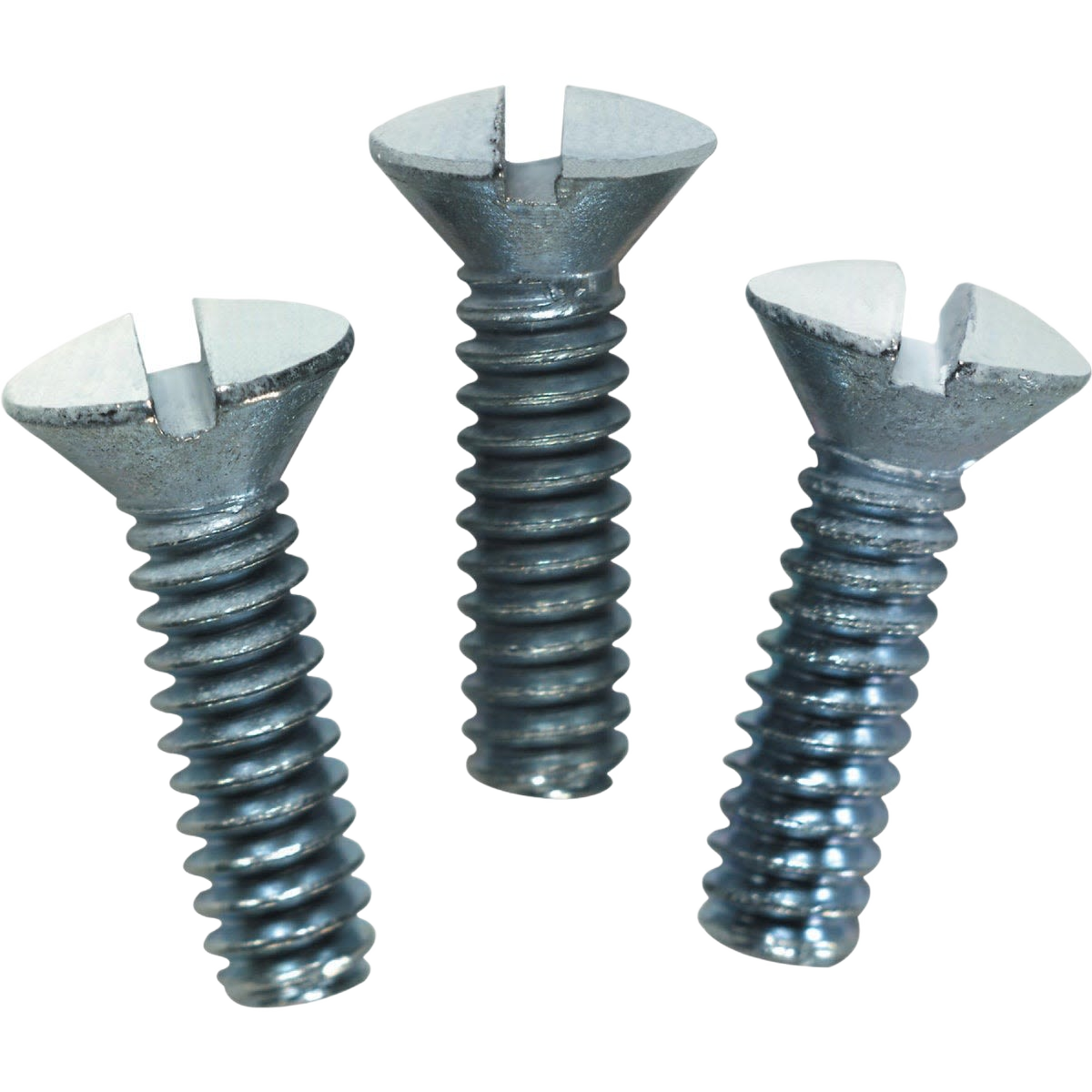 Three metallic slotted screws with flat heads for wall plate installation in home improvement projects