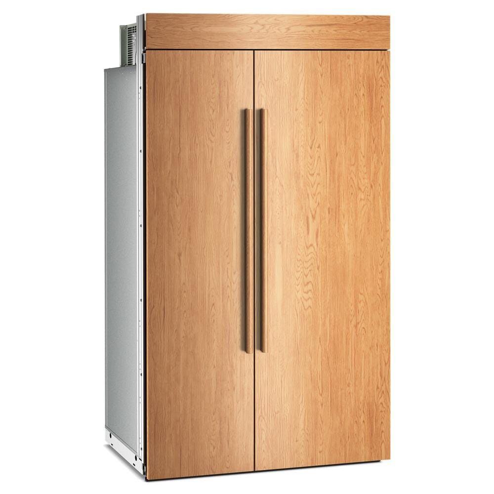 Built-in side-by-side refrigerator with panel-ready wood exterior and vertical bronze handles, part of KitchenAid side-by-side refrigerators at Hartville Hardware.