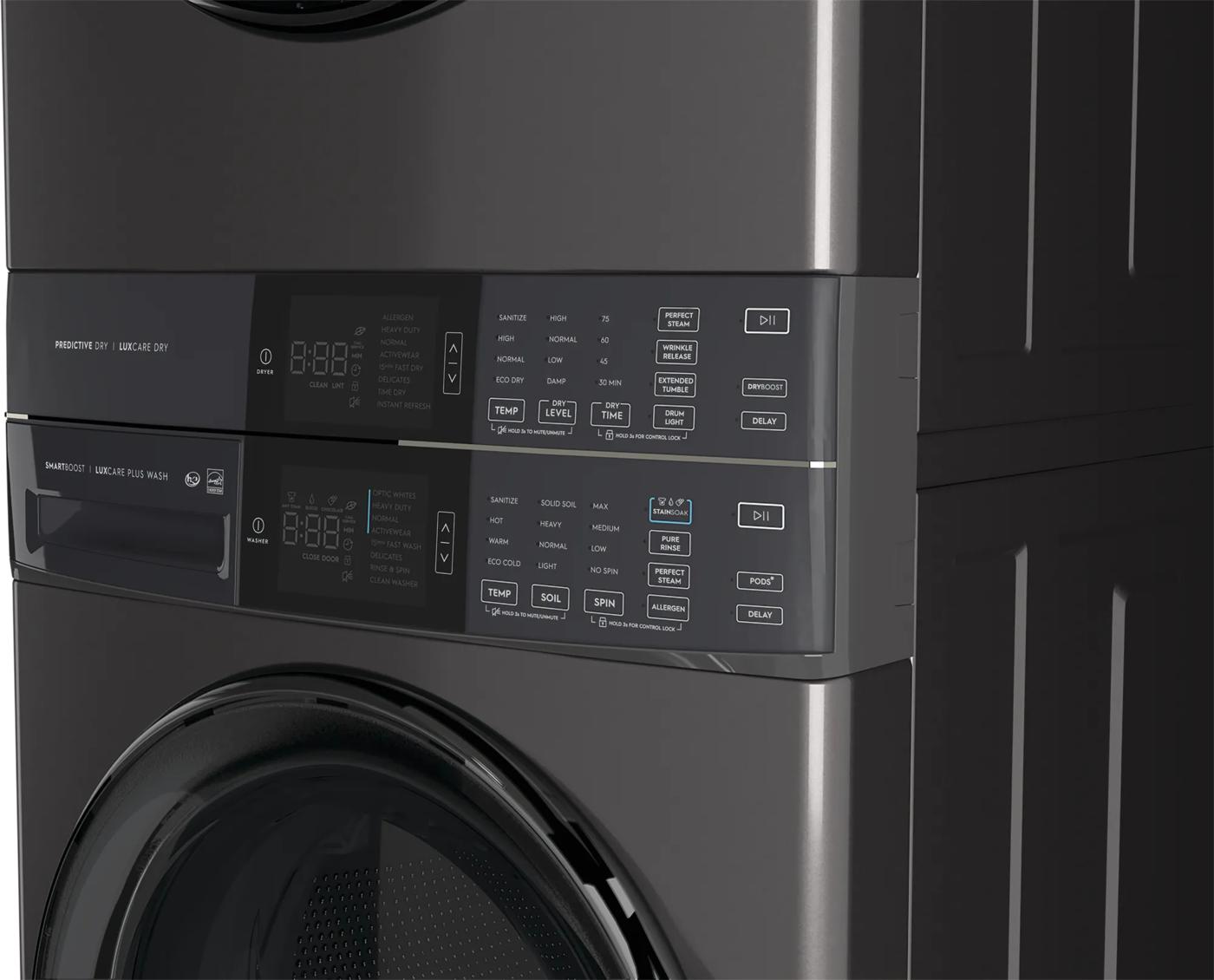 Dark gray stacked front load laundry tower showing detailed digital control panels on washer and gas dryer, part of Appliance laundry centers at Hartville Hardware.