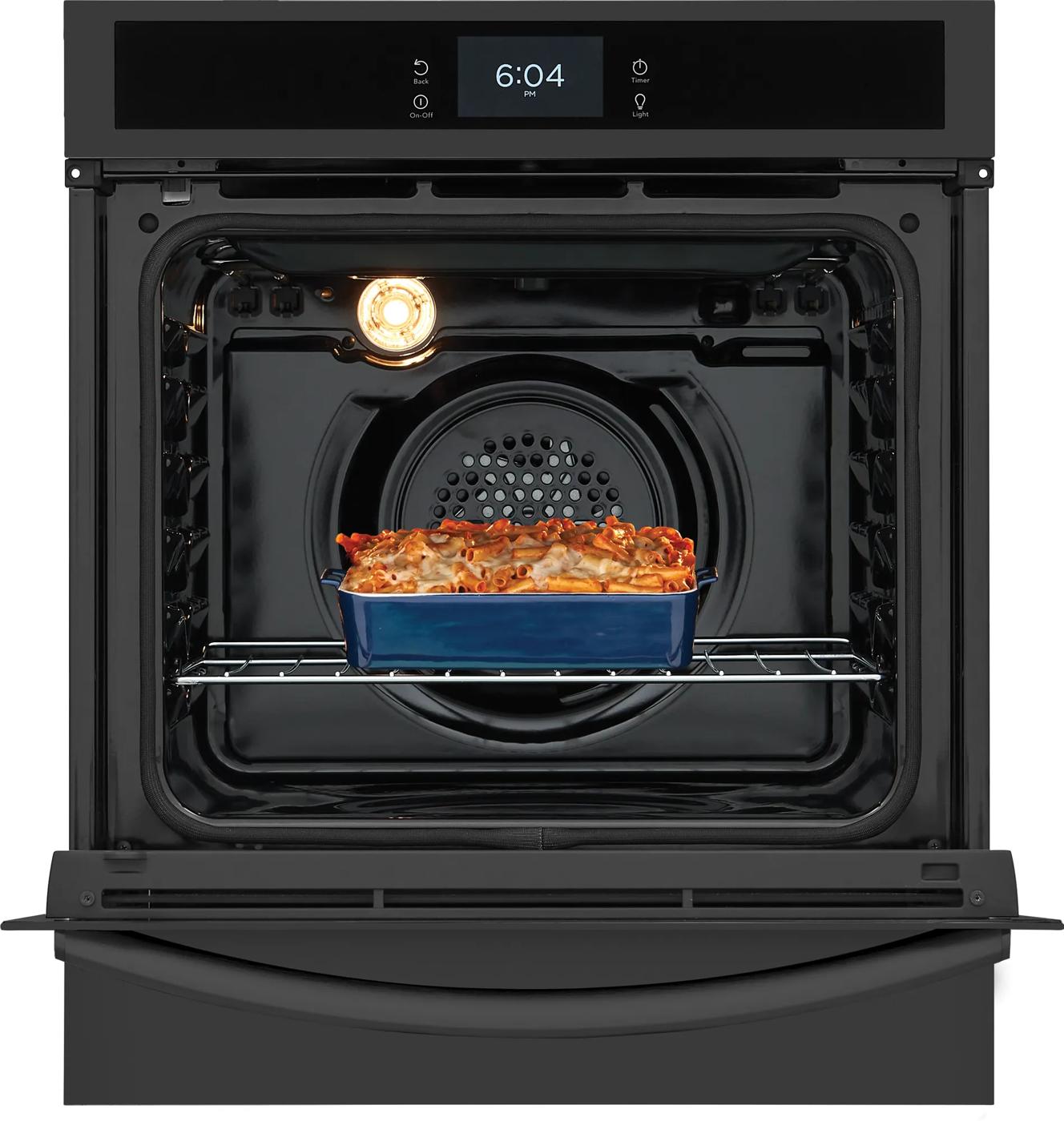 Black 24-inch single electric wall oven with air fry cooking dish inside, part of kitchen appliances collection