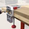 Self-clamping doweling jig with metal clamp and drill guide for precise wood joinery in home improvement projects