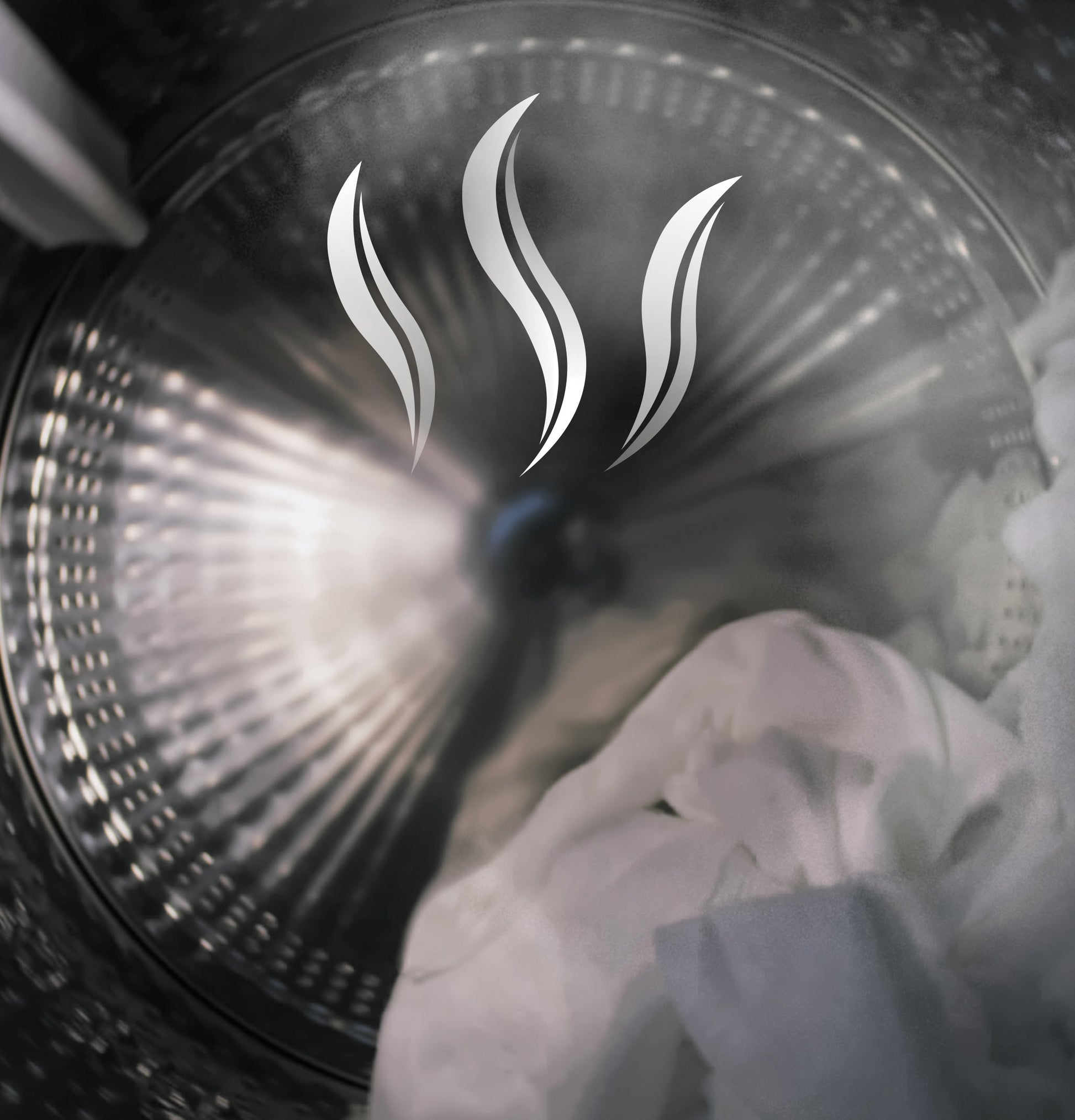 Steam rising inside stainless steel dryer drum with white laundry, illustrating advanced drying and sanitize feature