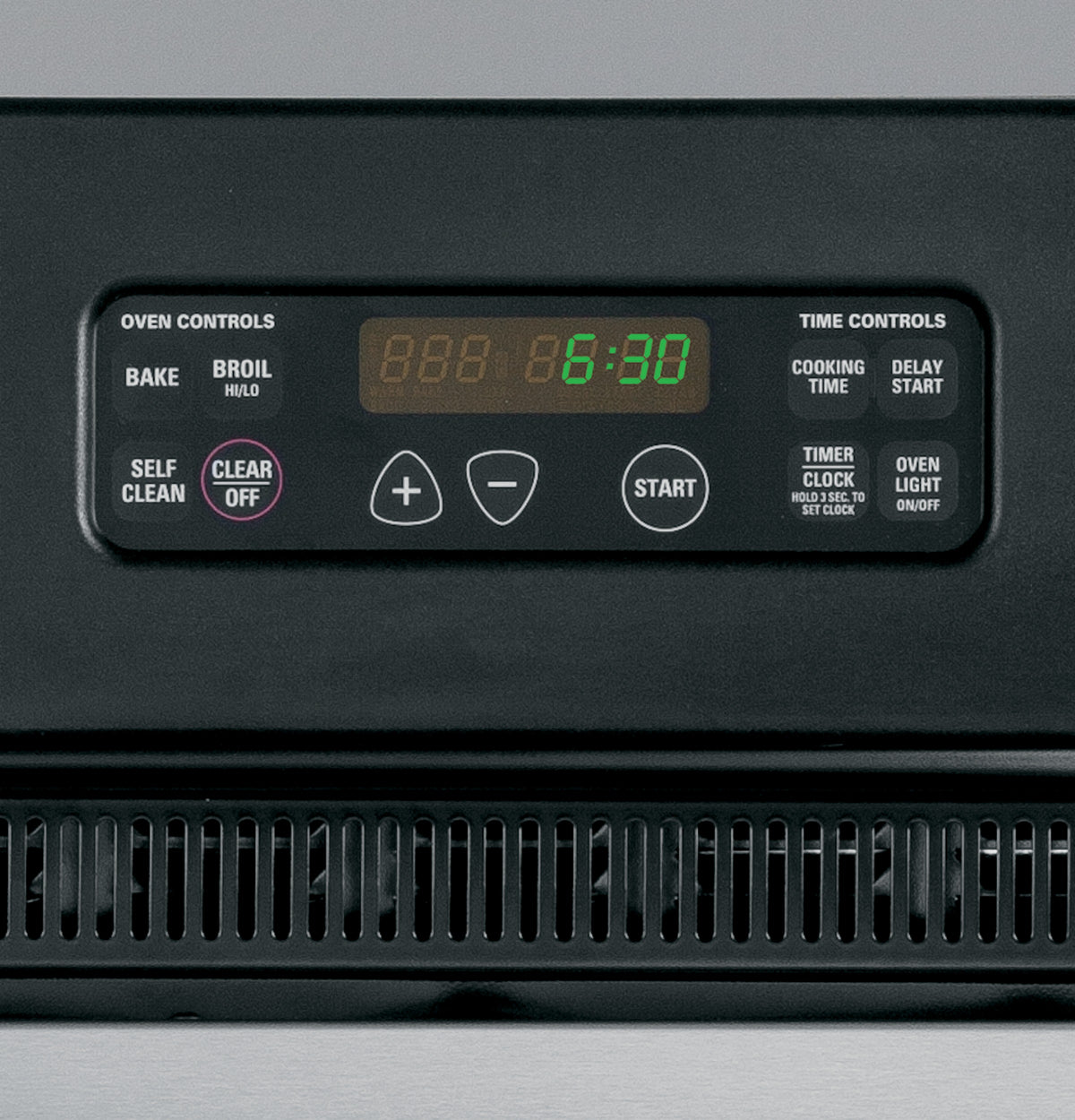 Close-up of digital control panel on black and stainless steel double wall oven with timer and cooking settings