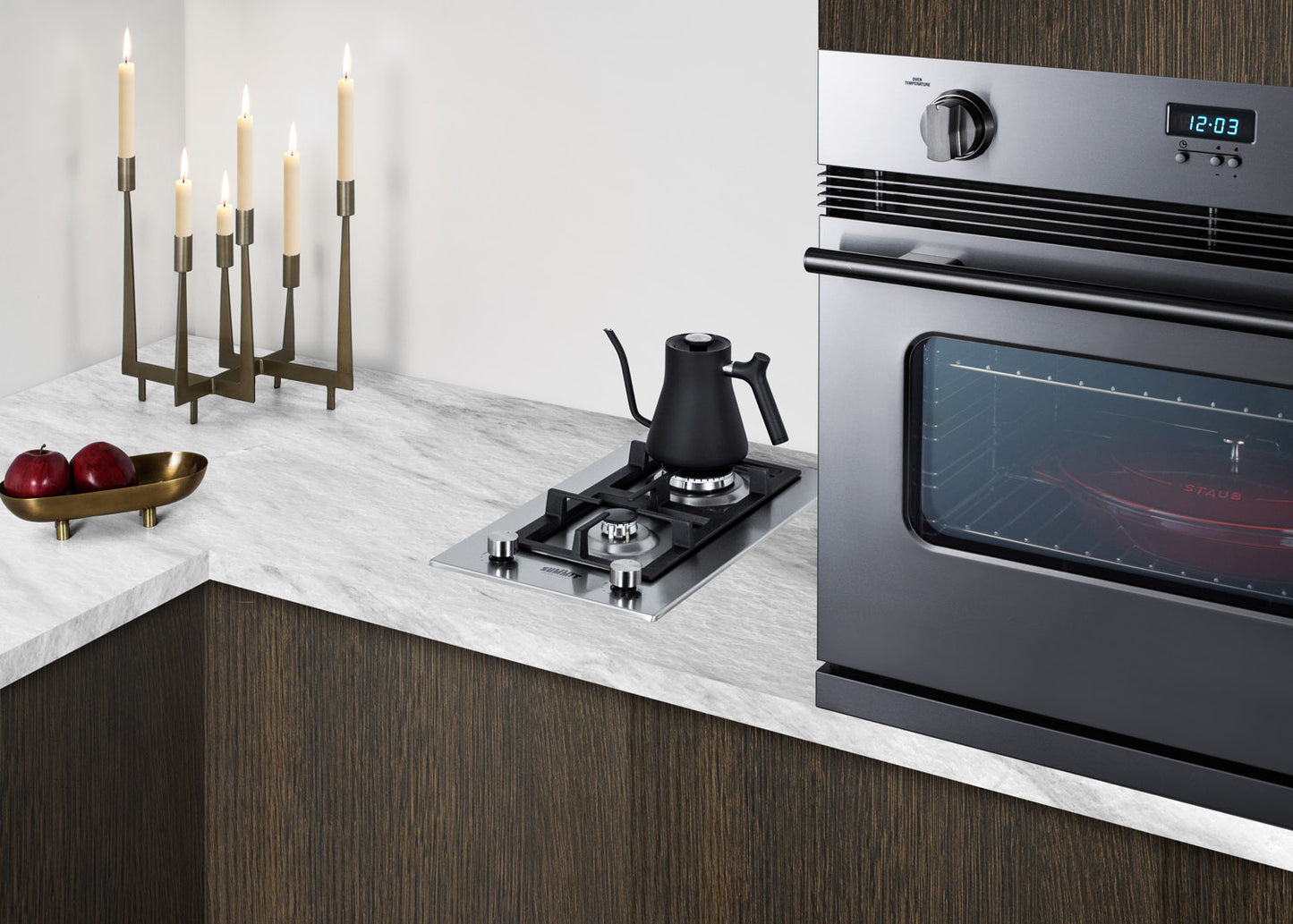 Stainless steel two-burner propane cooktop installed in marble countertop for kitchen home improvement use