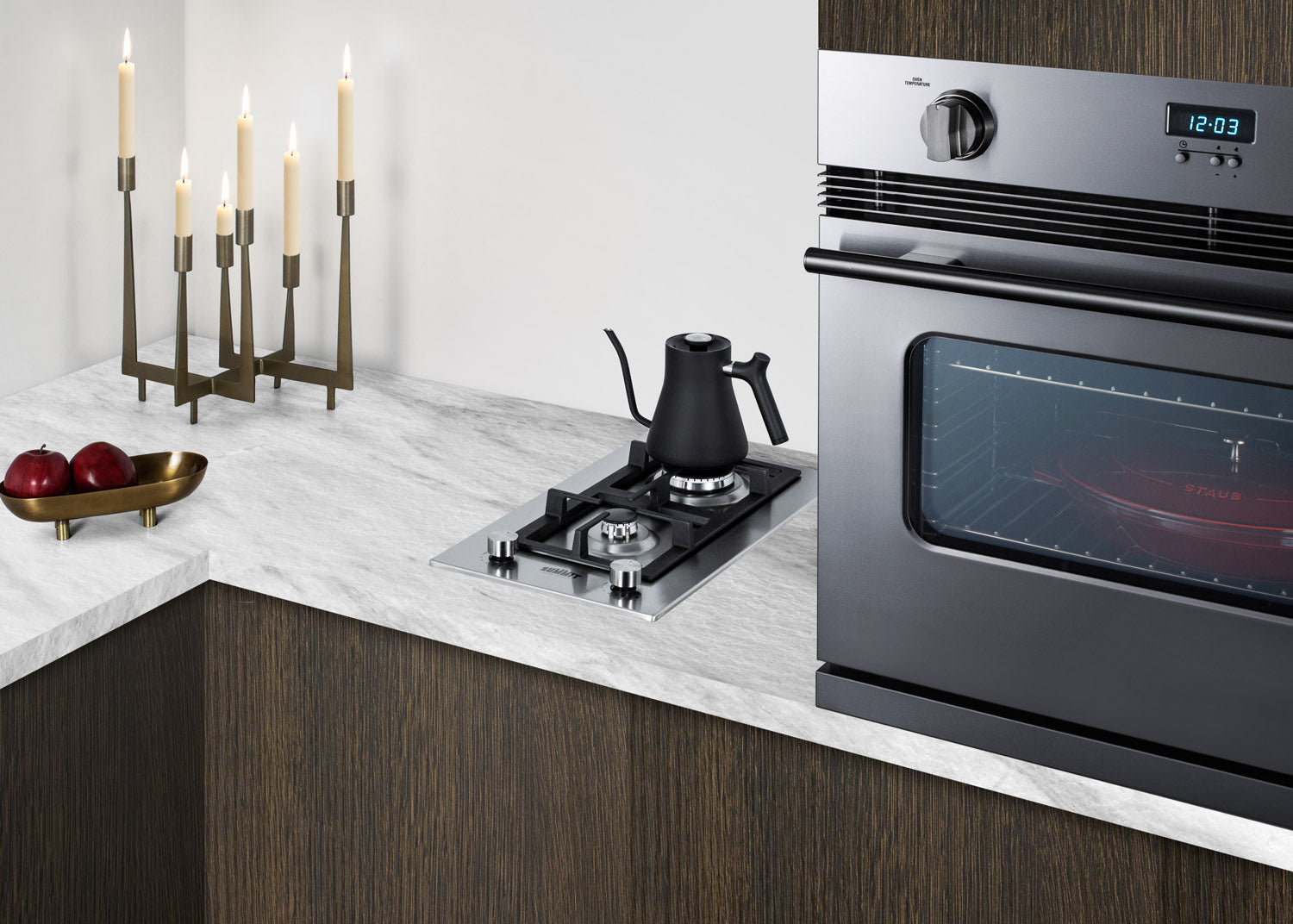 Stainless steel two-burner propane cooktop installed in marble countertop for kitchen home improvement use