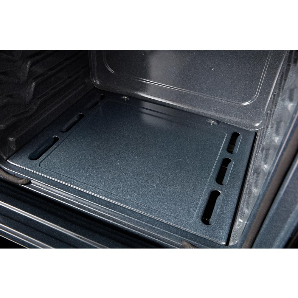 Interior view of a clean oven cavity with a smooth, dark blue-gray enamel surface for home improvement.