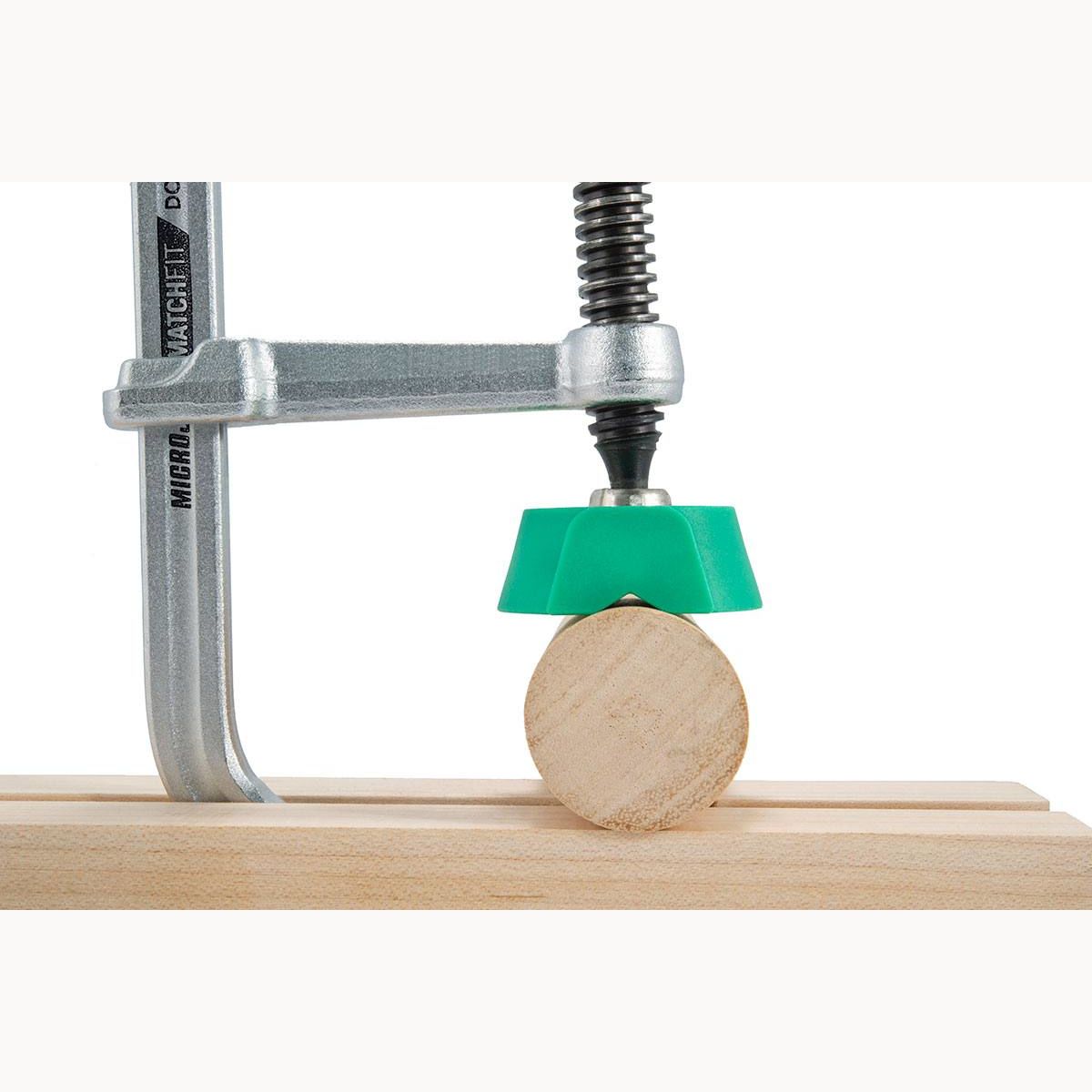 Green Microjig MATCHFIT clamping pad securing round wood piece in power tool accessories for home improvement