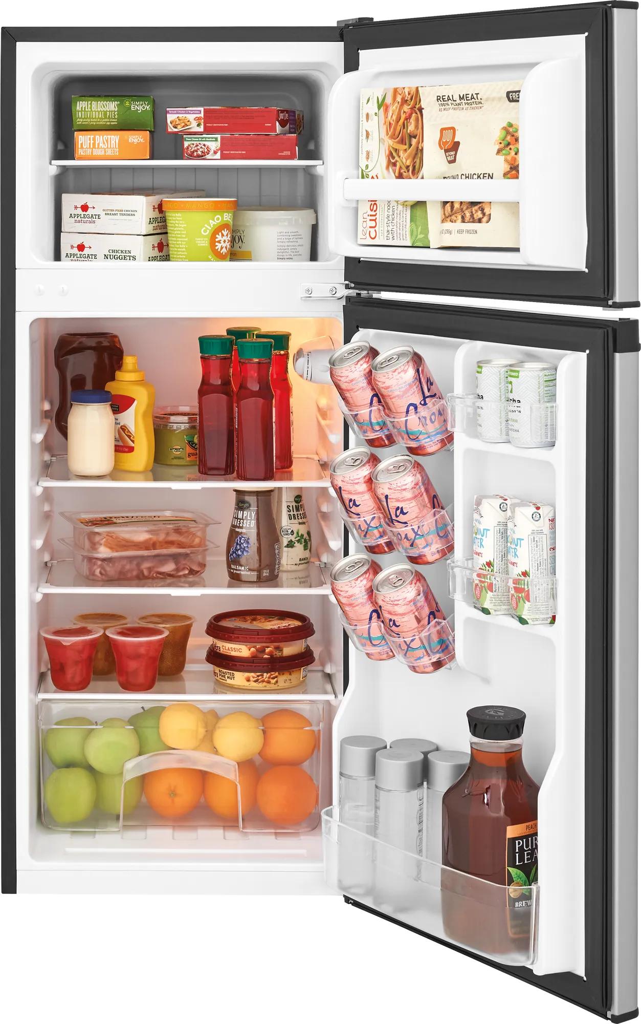 Compact refrigerator with freezer compartment, adjustable shelves, and stocked with beverages and groceries in appliances collection