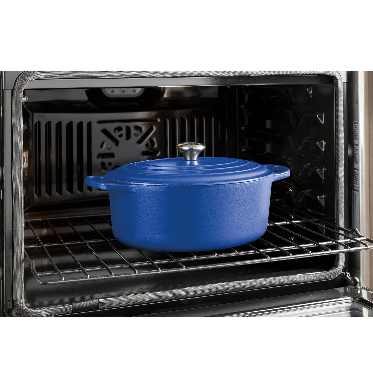 Blue cast iron pot with lid inside stainless steel built-in convection double wall oven from kitchen appliances collection