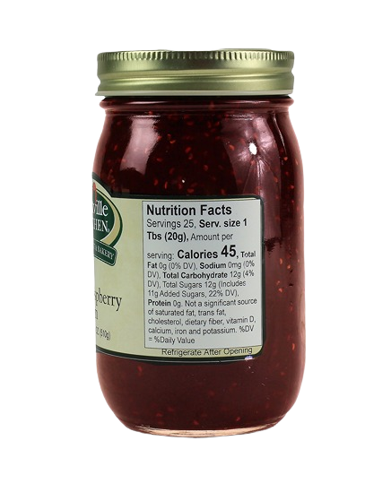 Glass jar filled with red raspberry jam featuring a gold metal lid in jams and jellies collection