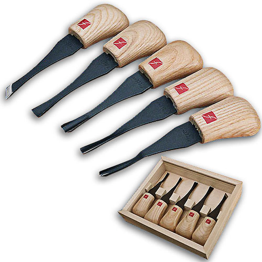Set of five wood carving tools with curved wooden handles and black blades arranged beside a wooden storage box