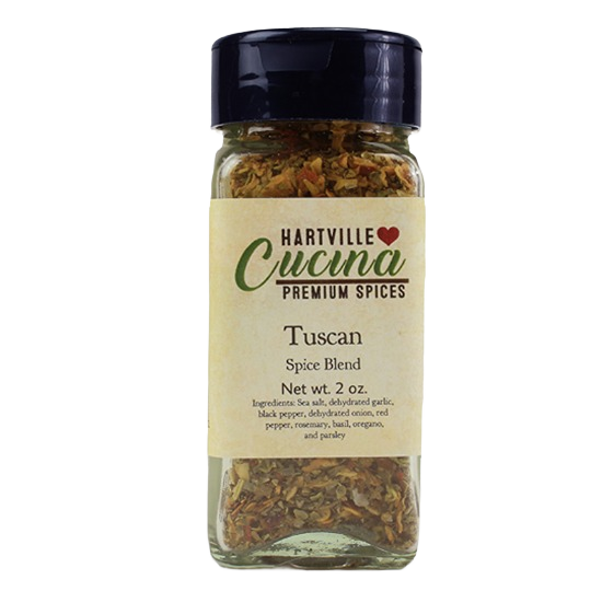 Clear glass jar of Tuscan spice blend with black lid, herbs and spices for grilling and food & beverage collections