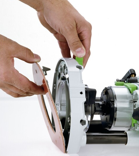 Hand adjusting a Festool router template guide base accessory for precision woodworking tool setup under $100