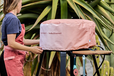 Blush pink limited edition grill cover designed for outdoor living and grill accessories under $100 collections