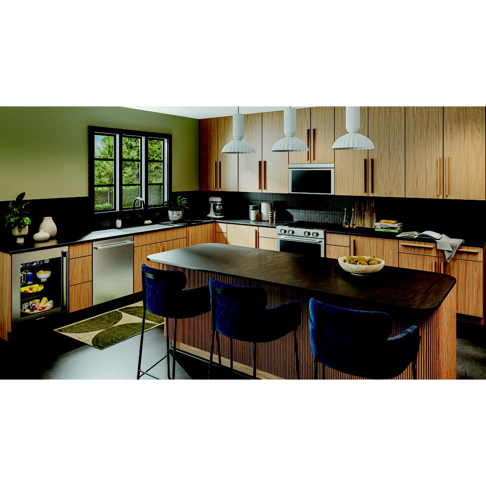 Modern kitchen featuring a compact undercounter refrigerator with glass door, wood cabinetry, and black countertop island with blue stools