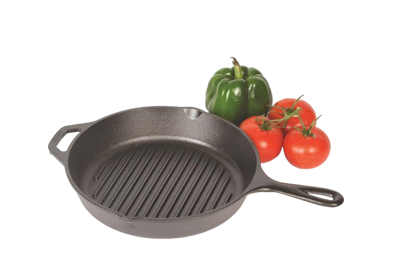 Round cast iron skillet grill pan with ridged surface and dual handles beside fresh green pepper and tomatoes for kitchenware.