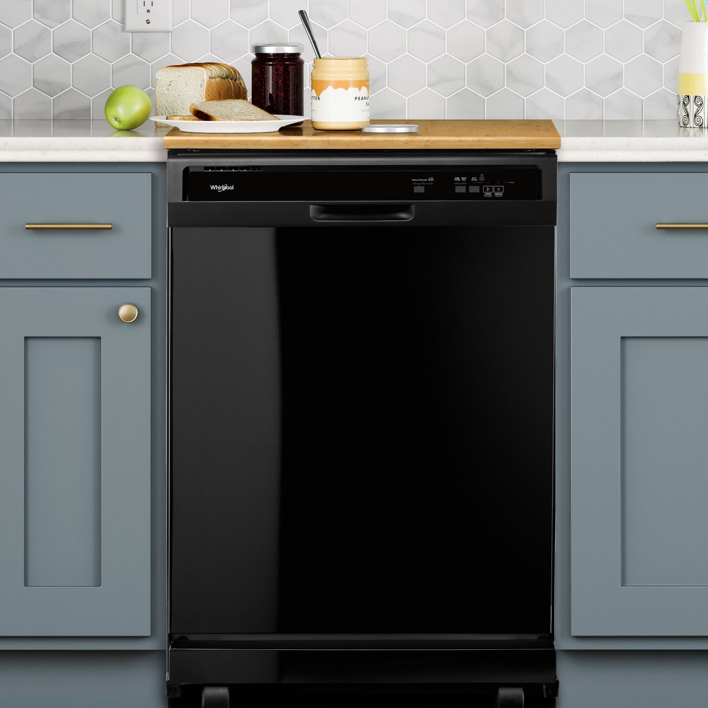 Black built-in dishwasher with digital controls in modern kitchen with blue cabinets and hex tile backsplash