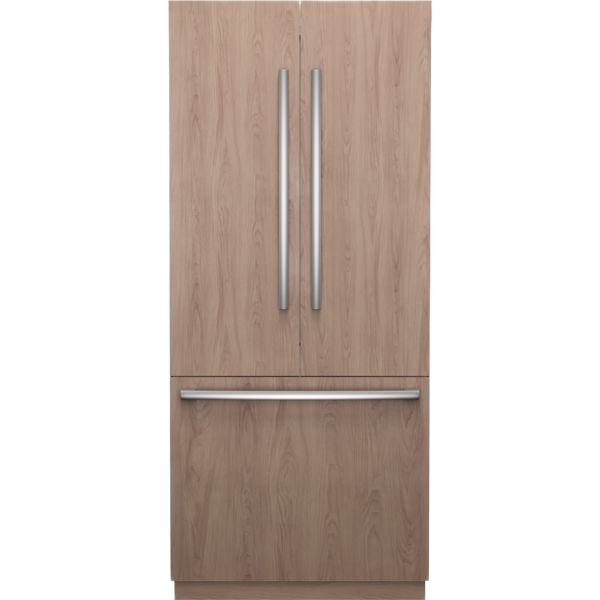 Built-in bottom freezer refrigerator with wood panel doors and modern stainless steel handles for kitchen cabinetry integration