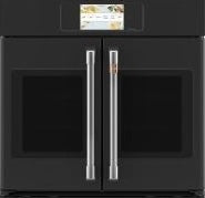 Black built-in double oven with stainless steel French-door handles and digital touchscreen in modern kitchen setting