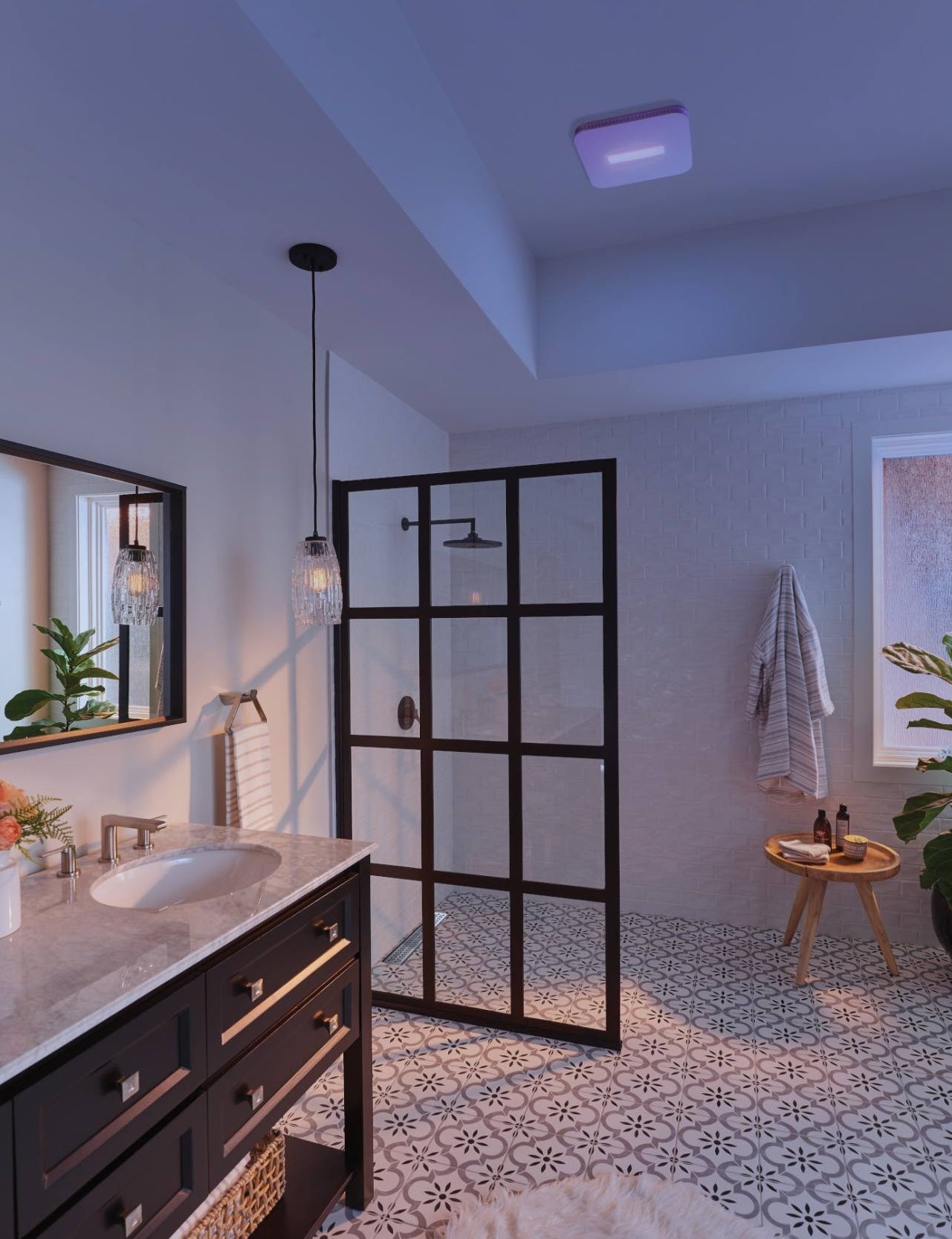 Square ceiling exhaust fan with soft glowing light installed in modern bathroom for ventilation and air quality