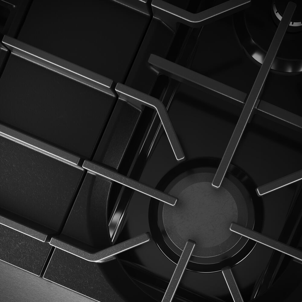Close-up of black cast iron burner grate on commercial-style gas range from Ranges and Kitchen & Kitchenware collections