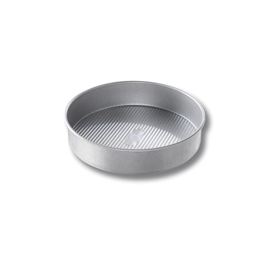 Durable round metal baking pan with ribbed bottom for even heat distribution in kitchenware and bakeware collections under $50
