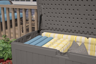 Outdoor resin deck box with stone finish storing cushions, ideal for patio furniture and garden outdoor living spaces