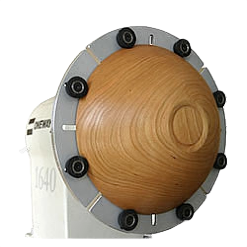 Wooden bowl secured by mini jumbo jaws on a lathe chuck for precision woodworking and home improvement tasks
