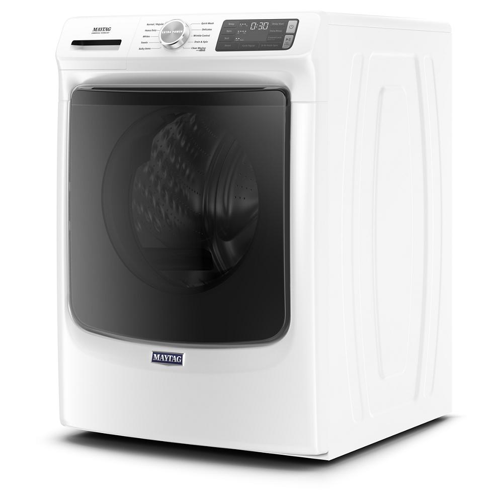 White front load washer with dark tinted door, digital display, and metallic control dial in washers and appliances collection