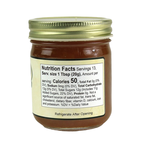 Glass jar of peach jam with nutrition facts label for jams and jellies in Hartville Kitchen food collections under $25