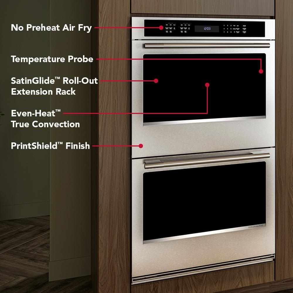 Built-in 30-inch electric double wall oven with digital controls and PrintShield™ finish in modern kitchen setting.