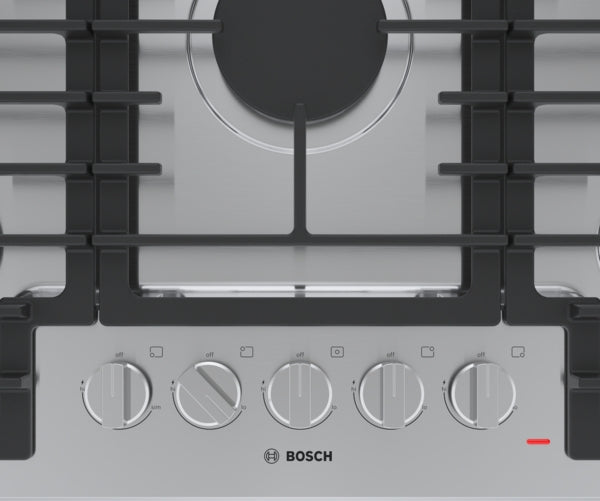 Close-up of Bosch stainless steel gas cooktop control panel with knobs from Gas Cooktops collection