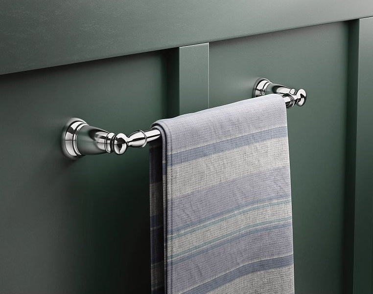 Polished chrome towel bar with decorative wall mounts holding a folded striped towel for bathroom improvement.