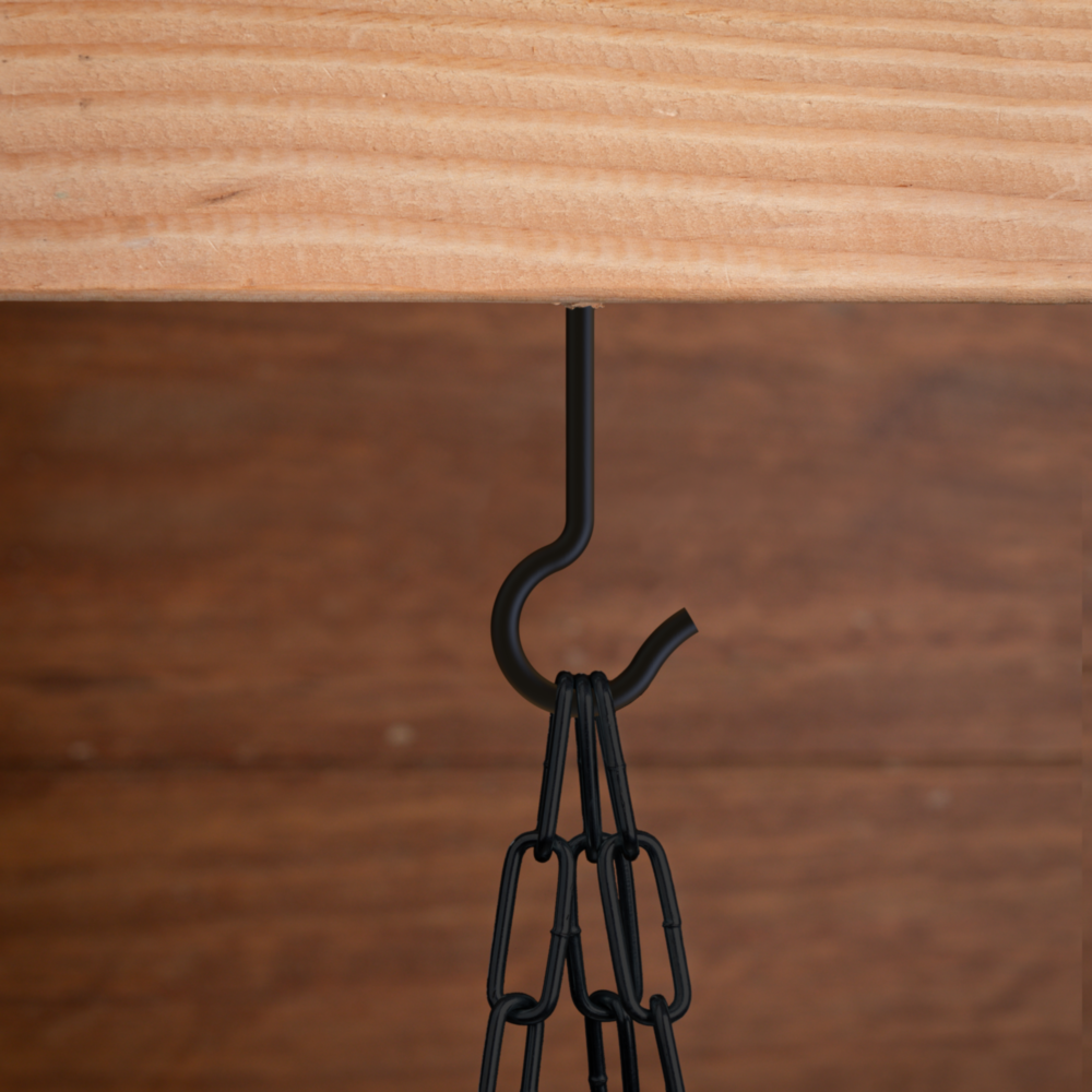 Black corrosion-resistant ceiling hook installed under wooden ledge for garage storage and home organization projects under $50
