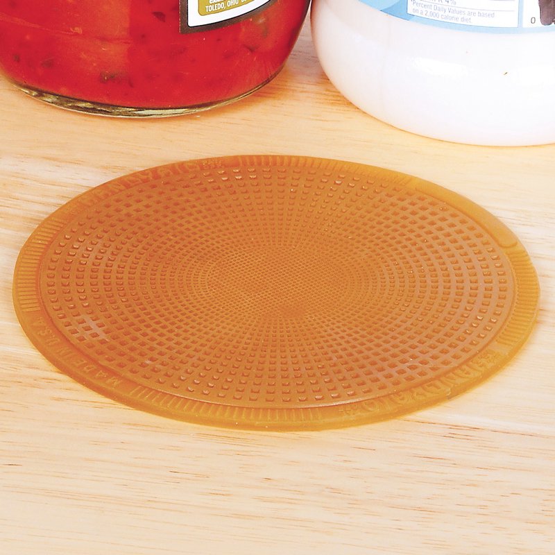 Round flexible grip pad with textured surface for easier opening of jars and bottles in kitchenware collection