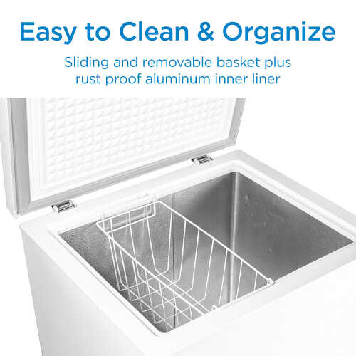 Top view of white chest freezer with open lid showing removable sliding basket and aluminum liner for kitchen appliances collection