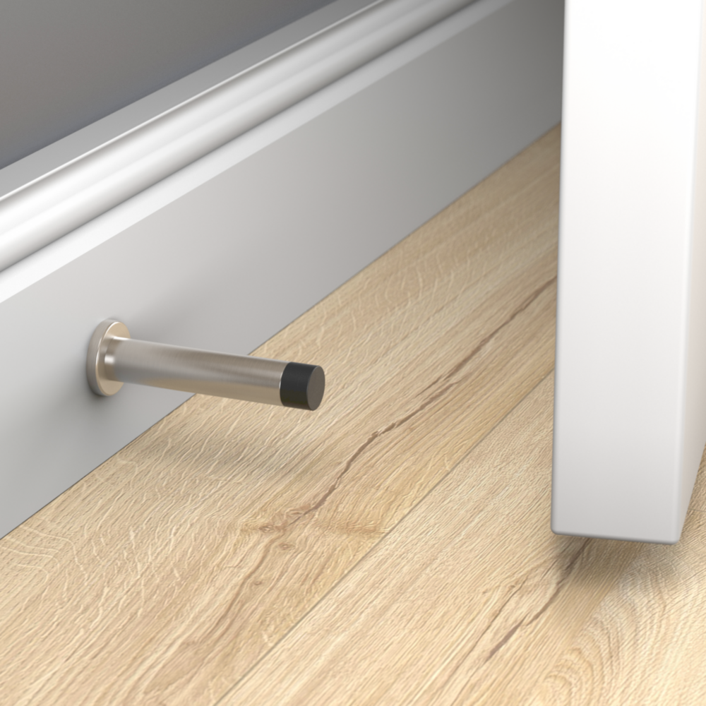 Satin nickel door stop with black rubber tip mounted on baseboard to protect doors and walls in home improvement tools under $50