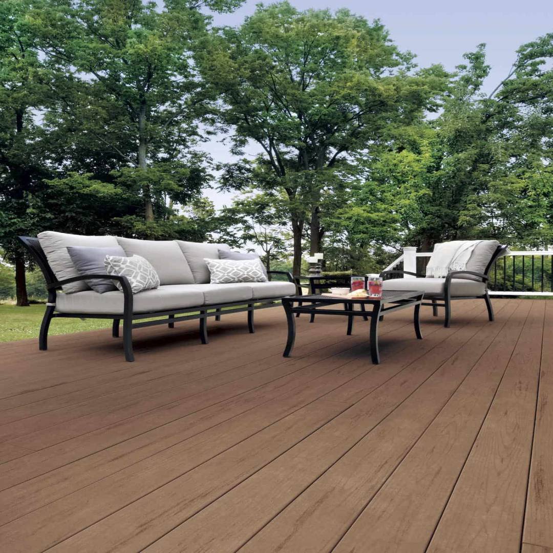 Outdoor seating area on brown Oak composite deck boards from TimberTech PRO Terrain collection
