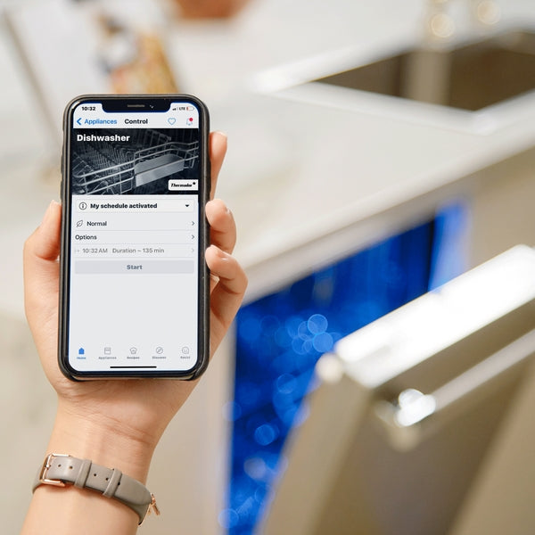 Smartphone displaying dishwasher control app with open dishwasher in modern kitchen setting in Appliances collection