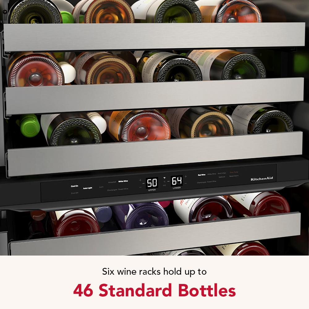 Close-up of undercounter wine cellar interior showing metal-front racks holding various wine bottles and digital temperature display