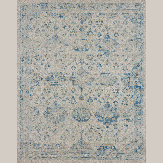 Decorative area rug with muted blue floral and geometric patterns on a soft beige background for home interiors.